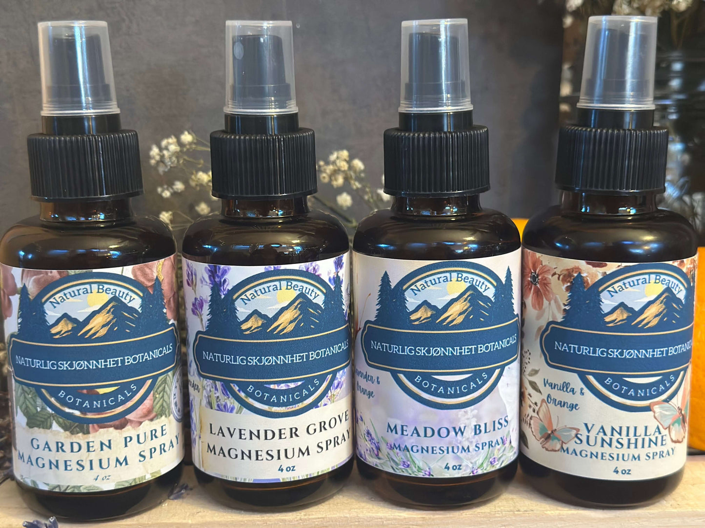 Four variants of Naturlig Skjønnhet Magnesium Spray displayed side by side