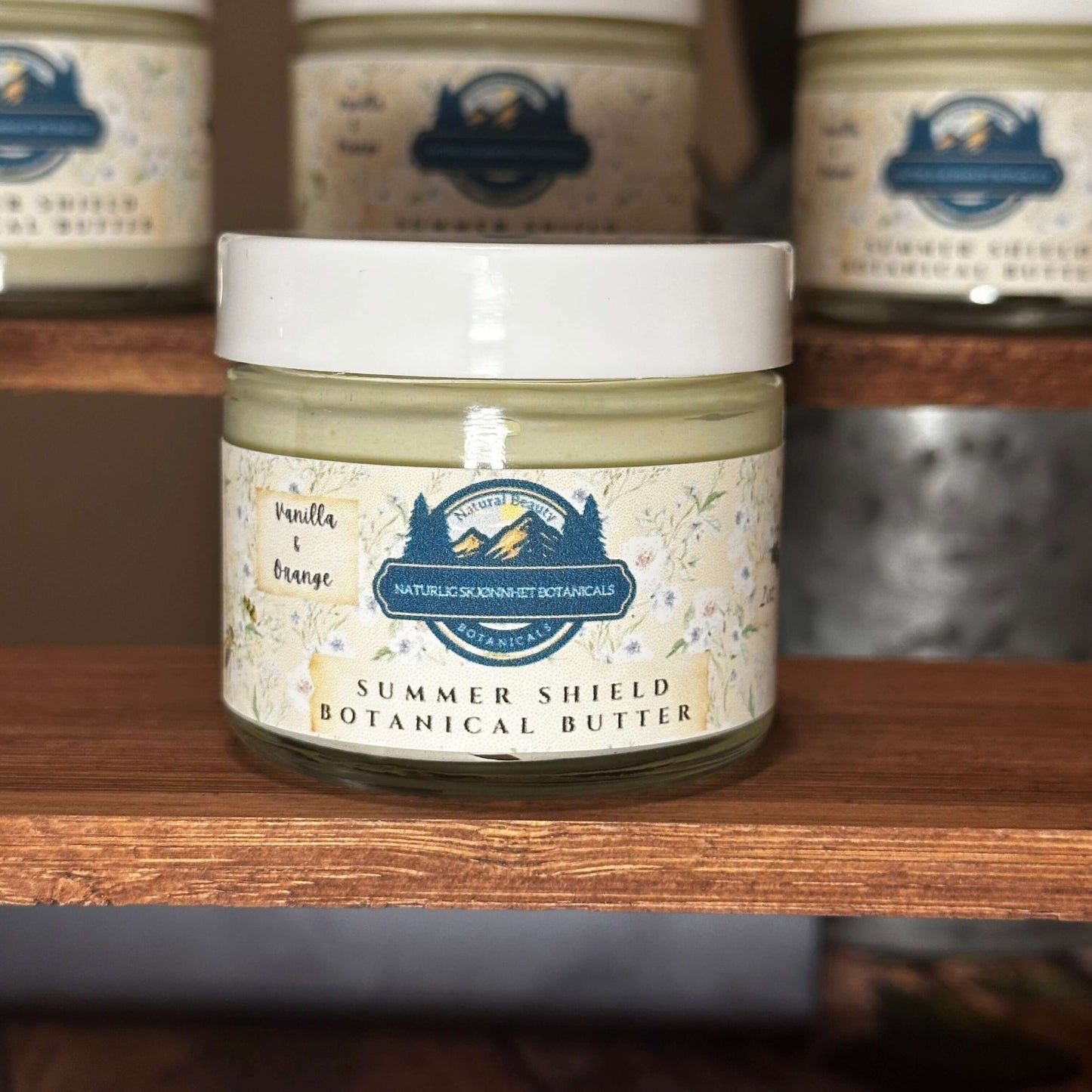 Whipped tallow-based body butter in glass jar designed for after-sun care