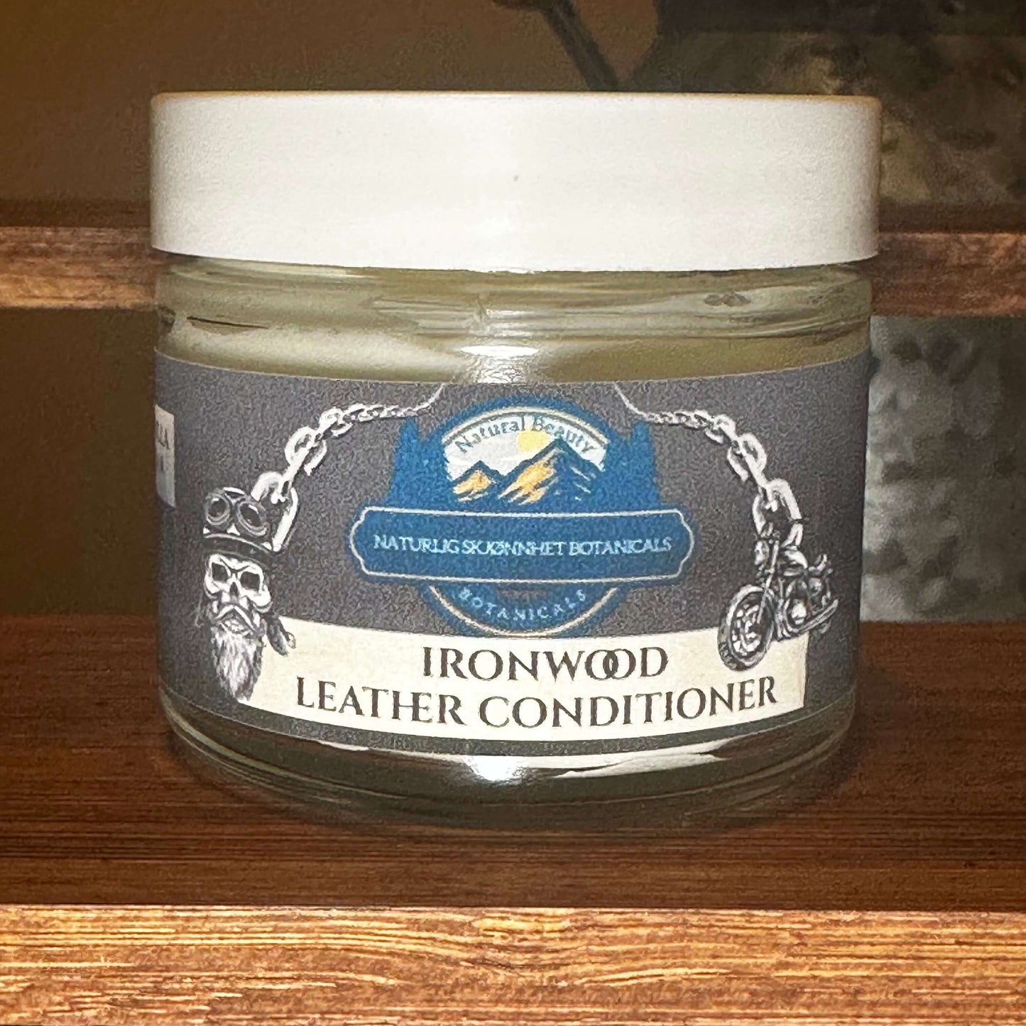 Ironwood Leather Conditioner jar with a natural, handcrafted design, infused with vanilla bean and tallow-based ingredients.