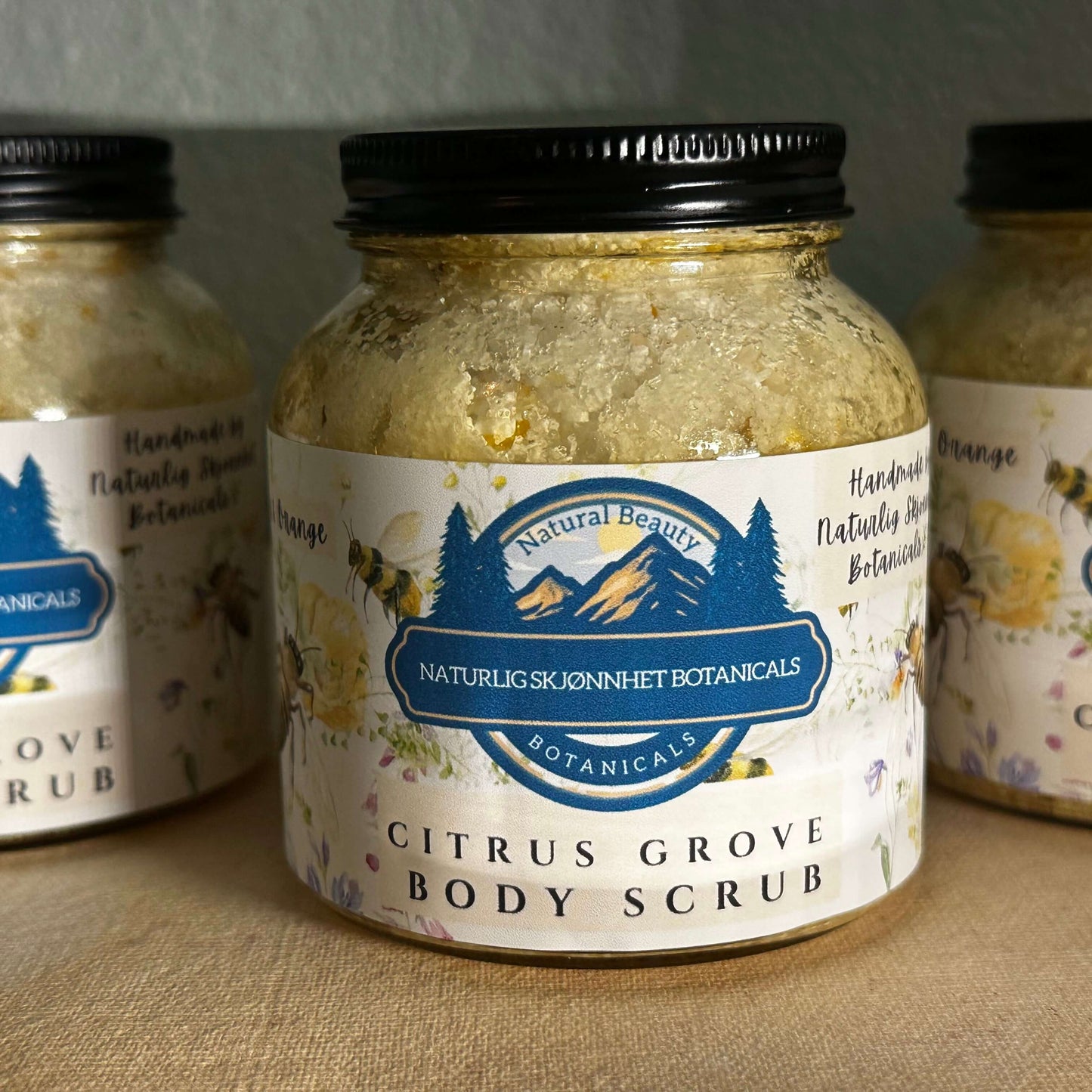 Citrus Grove Body Scrub in a jar, featuring natural botanicals for smooth, glowing skin. Handcrafted and toxin-free.